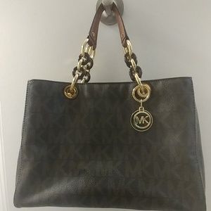 Authentic Michael Kors purse with gold accents